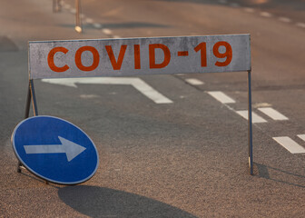Coronavirus disease sign on the street at the time of the pandemic