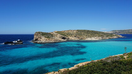 Obraz premium the view of Cominotto Island from the Blue Lagoon on Comino Island, Malta, March