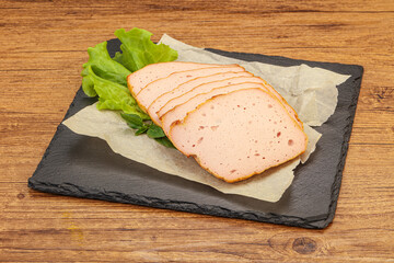 Boiled pork sausage over board