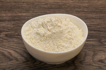 Wheat flour heap in the bowl