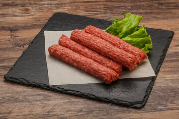 Raw beef sausages with spices