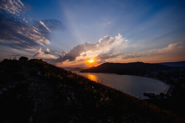 Colorful sunset in mountains. Seascape