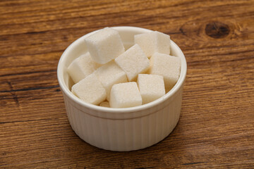 Refined white sugar cubs in the bowl