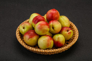 Sweet small nectarines in the basket