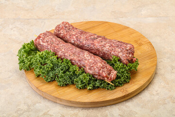 Raw minced beef kebab skewer