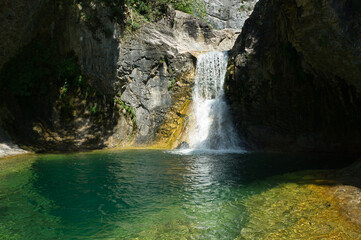 Fototapeta na wymiar Majestic Hidden Waterfall in Natural Landscape, located in the Aragonese Pyrenees, Huesca, Spain.