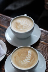 two cups of coffe on the table in the cafe