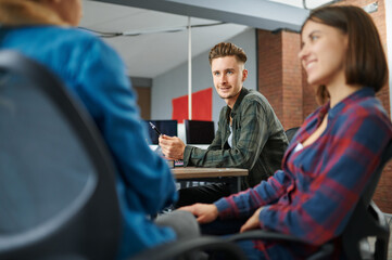 IT specialists talking in office, success work