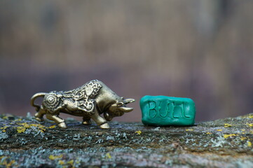 Metal bull figurine close-up.