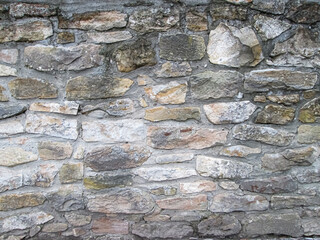 Smooth texture from old stones. Old wall masonry. Natural building minerals in various sizes.