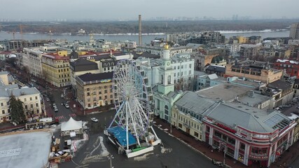 Europe, Kiev, Ukraine - February 2021: aerial view of the Podil area, St. Andrew's Church, Kontraktova Square and Kiev. Old residential buildings overlooking the city.