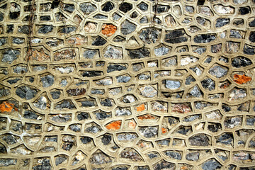 Multi-colored mosaic stone wall background
