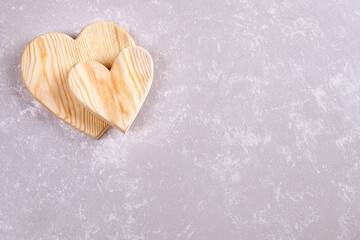 couple of wooden hearts on an abstract background. Valentine's day background.