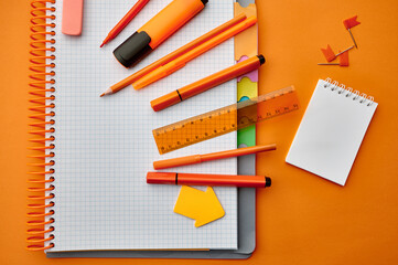 Stationery supplies, opened notepad, top view