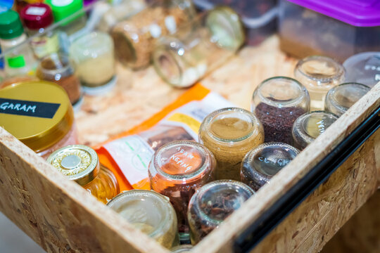 Kuala Lumpur, Malaysia - January 28, 2021: Top View Of Drawers With Spices Organized Inside. Modern Kitchen Countertop With Food Ingredients.