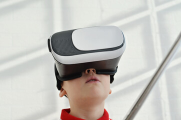 A child looks info virtual reality glasses.