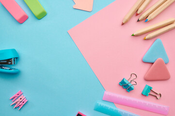Stationery supplies, blue and pink background