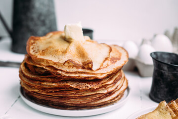Thin pancakes with milk in a plate. crepes 