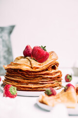 Thin pancakes with milk in a plate. crepes 