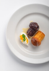 Italian dessert baba from Naples on plate isolated on white, top view