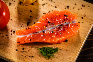 Fresh raw butterfly salmon on cutting board
