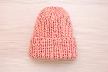 Pink women's wool hat on white background