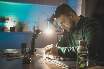 Technician repairing laptop at home