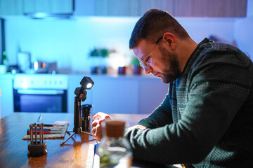 Technician repairing laptop at home