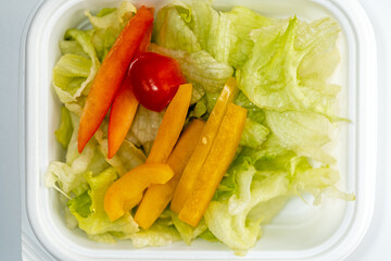 Vegetable salad sliced lettuce and cherry tomato bell peppers