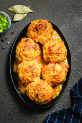 Chicken and rice Italian meatballs casserole in cast iron skillet. Top view, space for text.