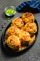 Honey garlic turkey meatballs and gravy  in cast iron skillet. Space for text.