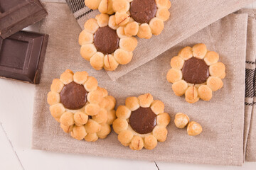 Flower shaped chocolate biscuits.