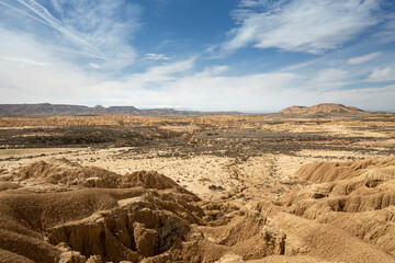 Scenic desert  landscape with dry ground and blue sky in Spain