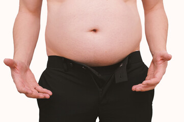 Naklejka premium Overweight man with large belly holding out hands in frustration when the pants are too small. Isolated on white background.