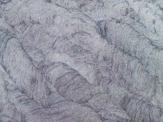 Dark purple streaked stone. Abstraction with a mineral.