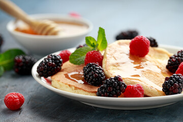Morning breakfast Pancakes with fresh berry and honey. Healthy food
