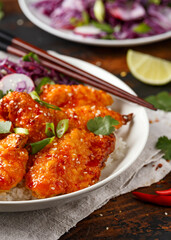 Korean Fried chicken with red cabbage salad and white rice. Asian food
