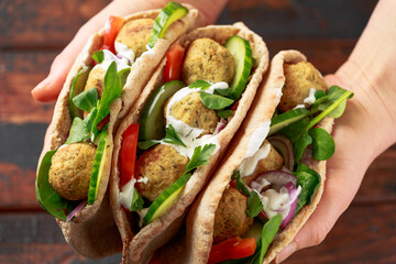 Vegetarian Chickpea falafel pita bread with pickled chilies and fresh salad. healthy vegan food.