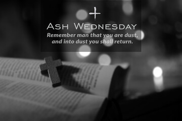 Ash Wednesday. Remember man that you are dust, and into dust you shall return. Ash Wednesday concept with wooden holy cross crucifix of Jesus Christ on open bible book page in black white background.