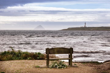 seat with view of Ailsa Craig and lighthouse on Arran