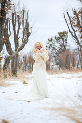 Beautiful bride outdoors on winter day