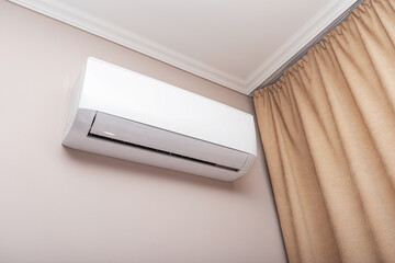 Air conditioner on the wall in the room.