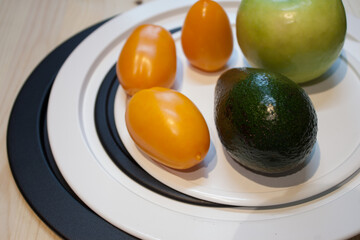 avocado in basket. Avacado green in the store on the counter in a basket.