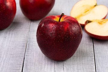 red apples on wooden table