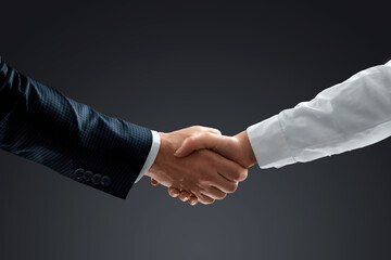 Handshake with effect, teamwork, partnership concept, business communication. Close-up.