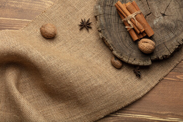 Anise star and cinnamon stick on a wood