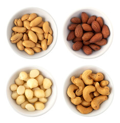 Nuts in circle shaped ceramic bowls isolated on white background. Various nuts (almonds, macadamia, cashew, peanuts). Mix nut  healthy ingredients food.