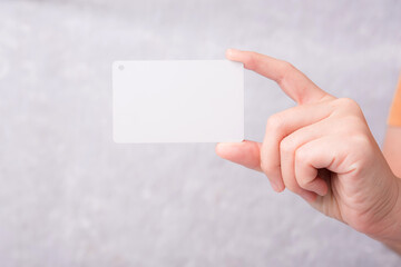 Obraz premium Credit card in female hand on white background