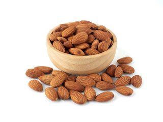Organic almonds in wooden bowl and heap almonds isolated on white background for almond nuts can improve health concept.