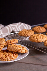 freshly baked warm oatmeal cookies on a cooling rack